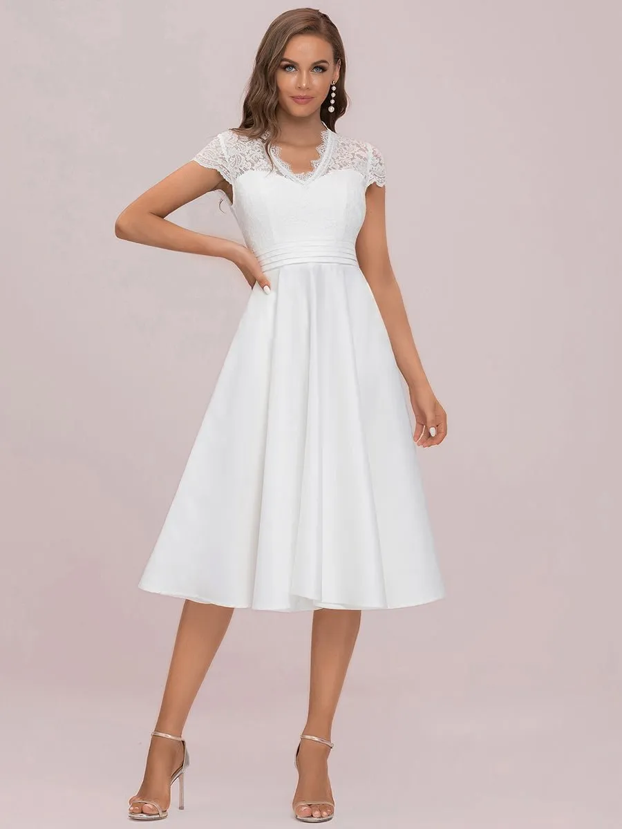 June Ivory satin and lace below knee wedding dress Express NZ wide